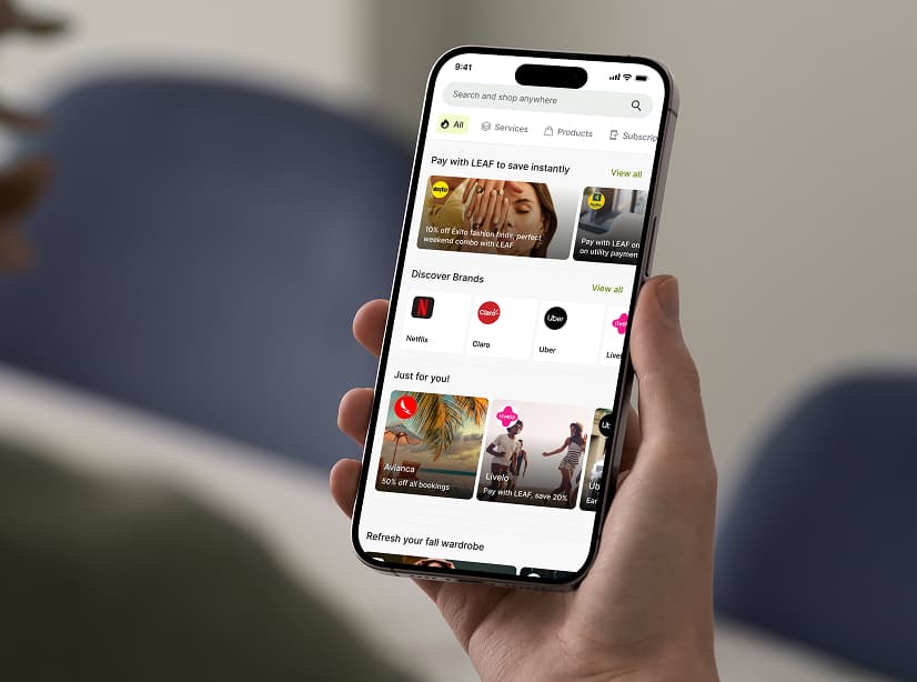 A ReLeaf Telco customer holds their cellphone, browsing shopping options to spend rewards their phone earned for them